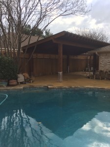 Custom wood arbor and fence by a pool